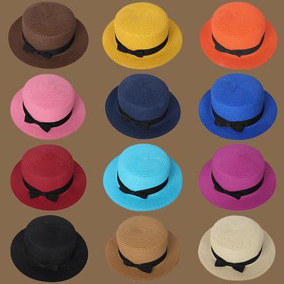 Frühling und Sommer Neuer Strohgestrickter Schleifen-Strohhut Koreanische Mode und Freizeit Faltbarer Strand Flache Oberseite Kurze Krempe Strohhut
