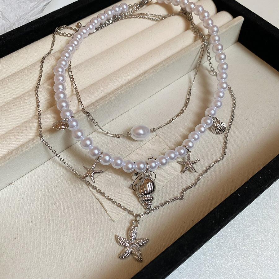 

Подвеска-кулон из жемчуга в виде морской звезды и раковины, модная, праздничная, с темпераментом, цепочка на ключицу, легкая роскошь, универсальная, нишевая бижутерия