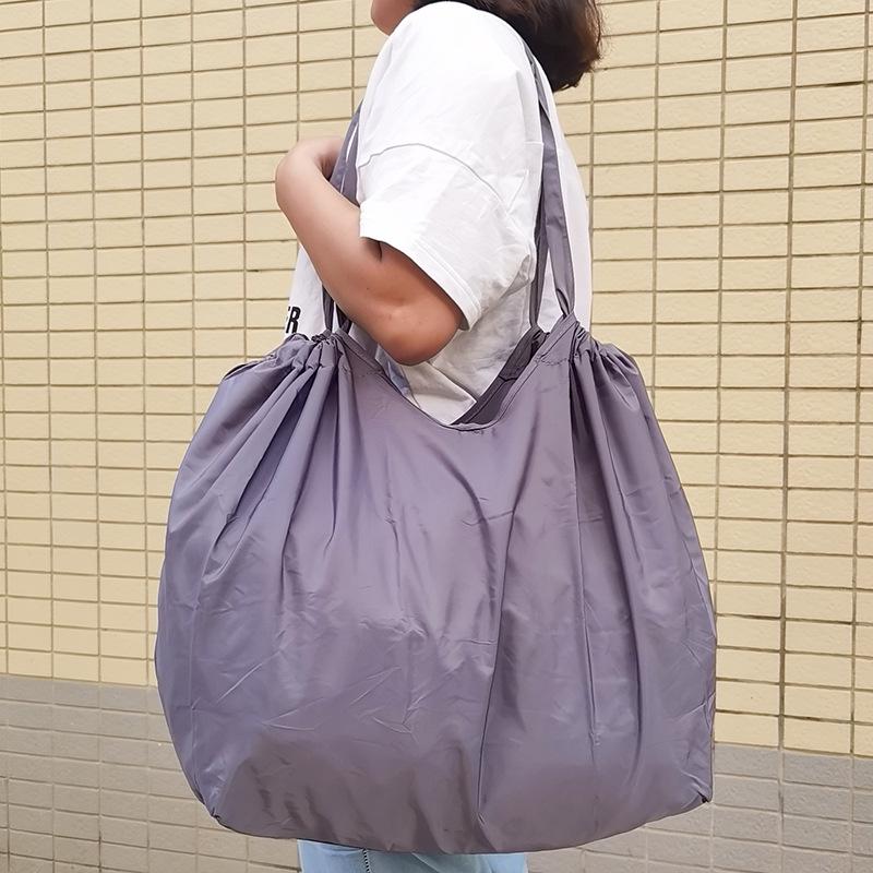 Eco-Friendly Foldable Shopping Tote with Buckle, Drawstring Closure, and Single Shoulder Strap