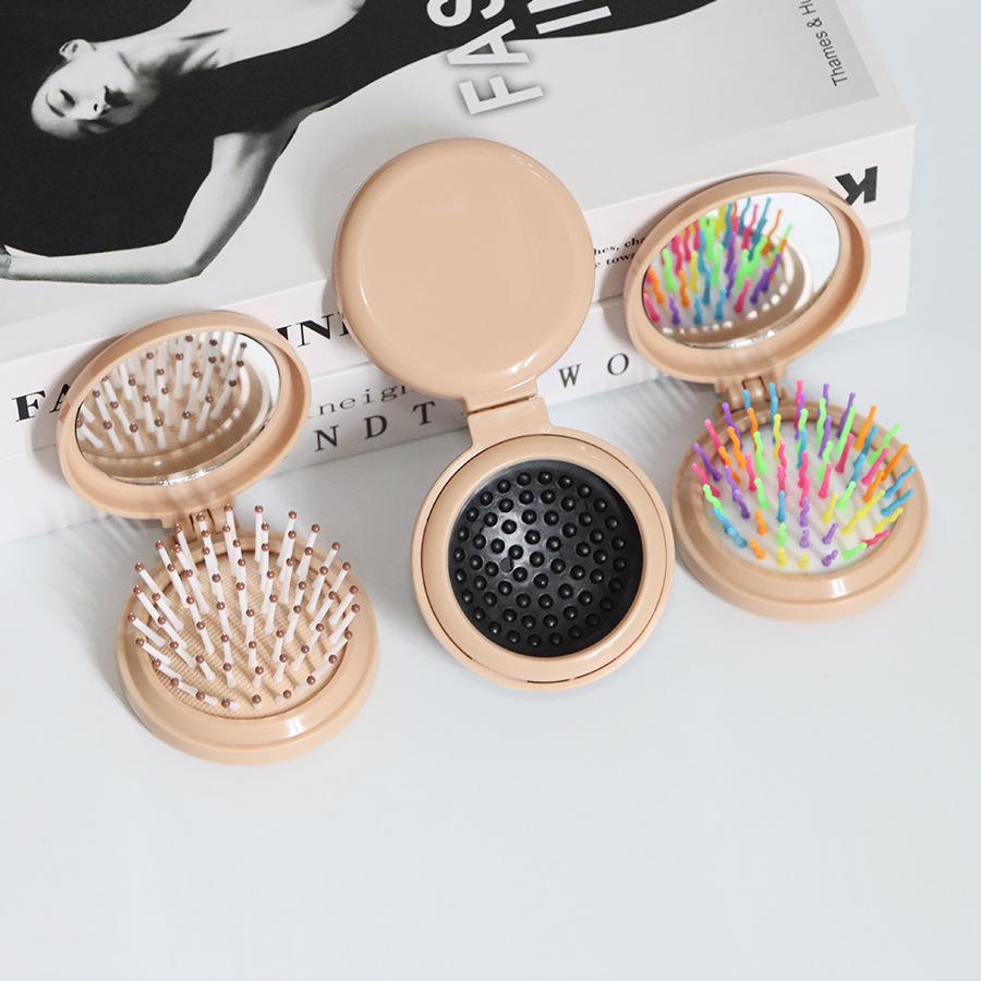 Kompakter Klappkamm & Schminkspiegel mit Airbag-Polster für Kopfmassage