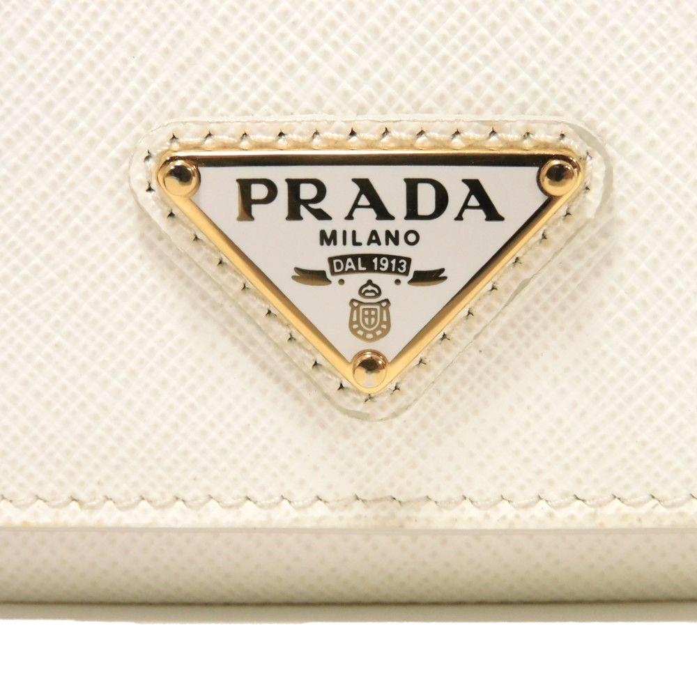 Used 11569 Saffiano Triangle Card Holder 1MC110 QHH F0009 7946 Current Calfskin White Bifold RFID Logo Bianco Unisex