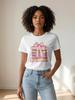 A stylish and versatile white T-shirt with pink book and bow-themed details, perfect for a sophisticated summer look.
