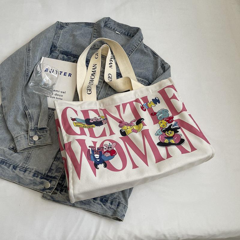 Canvas bag women's large capacity 2025 new bag portable commuter bag casual fashion fresh bag single shoulder mommy bag