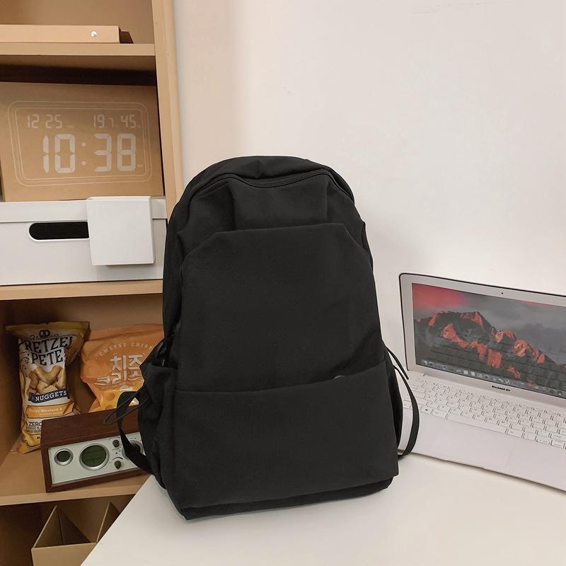 Schoolbag new large-capacity high-value junior high school student casual schoolbag Japanese and Korean version solid color fashionable simple