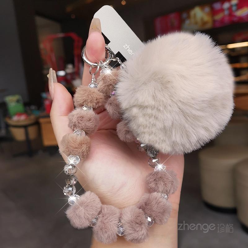 

Mobile phone chain hairball crystal bead pendant, women s wrist rope, short autumn and winter outdoor travel line, shopping and taking pictures