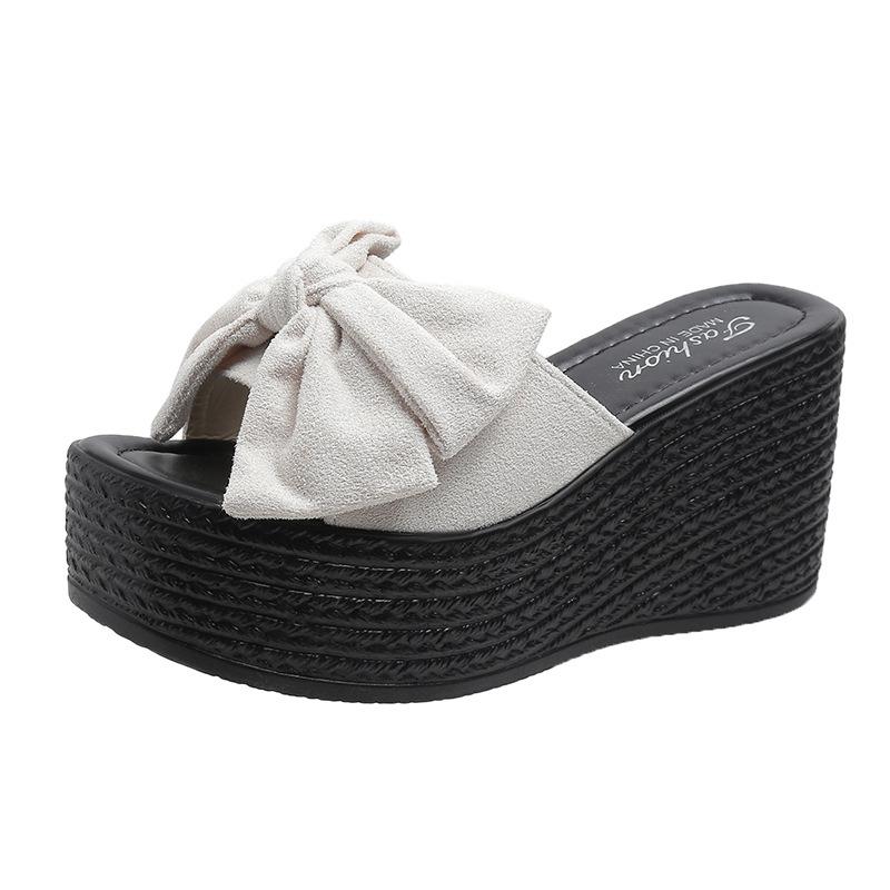 Sandals women spring and summer new slope heel thick bottom go out bow slippers fashion one word drag women