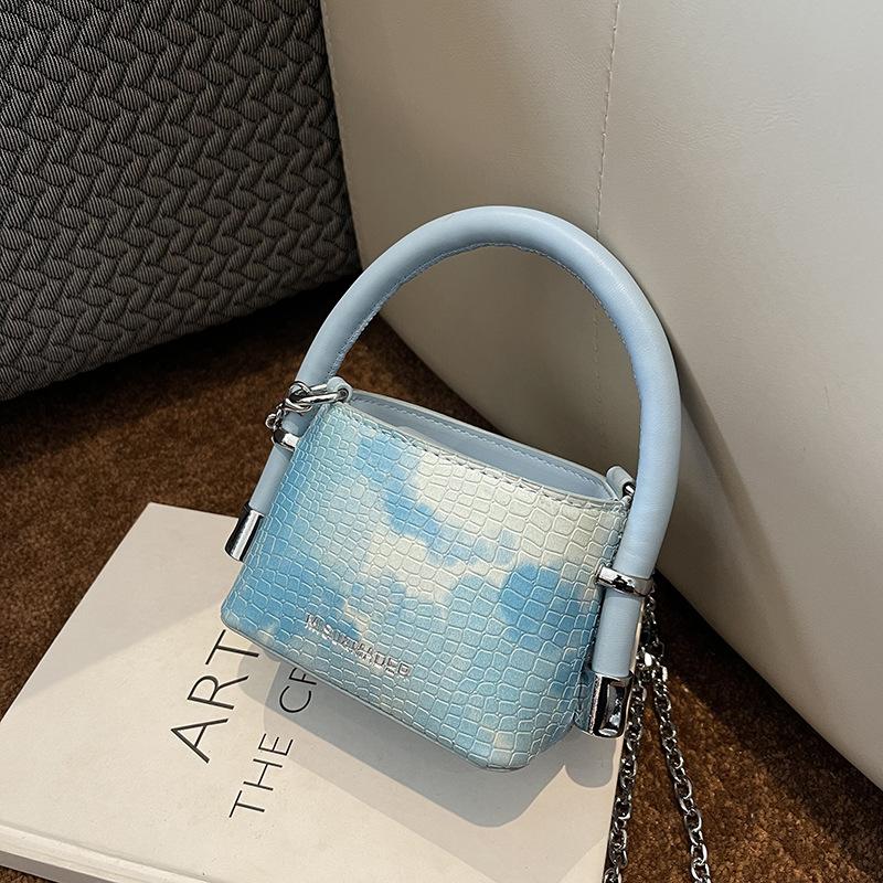 

Korean version of fashion niche portable mini bucket bag women s bag 2025 new spring shoulder crossbody change bag синий
