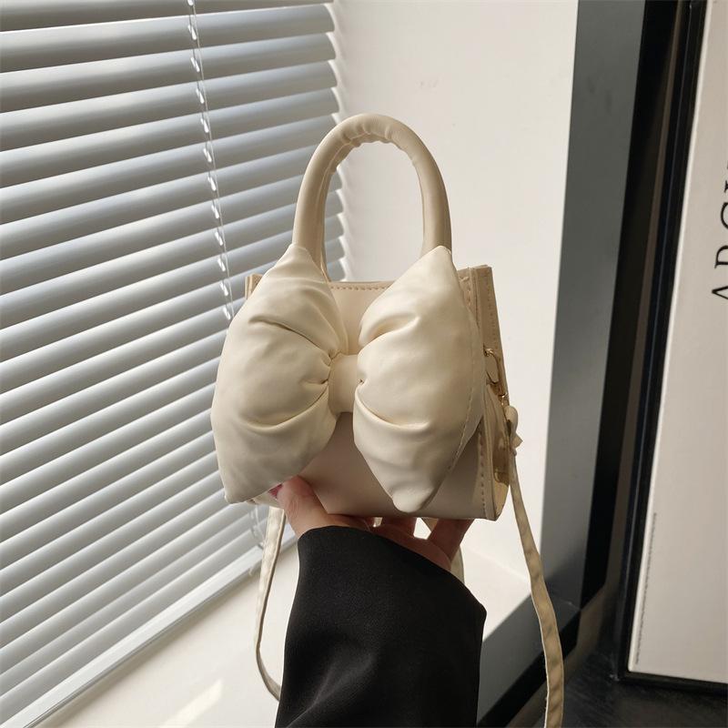 Niche bow solid color new mini hand carry small square bag summer beautiful retro shoulder messenger bag women