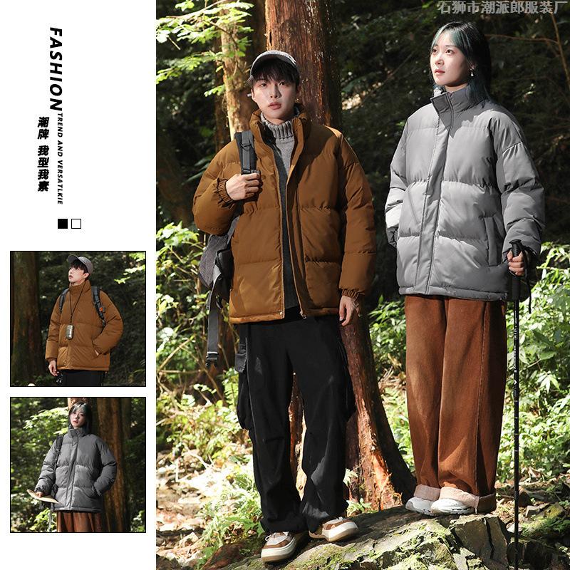 Large size cotton-padded clothes are the same for men and women. Winter thickened stand-up neck cotton-padded jacket, loose thickened cotton-padded 