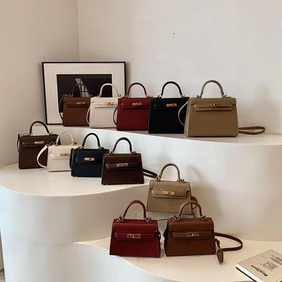 Neue High-End-Litschi-Muster-Größe Kaibaoli Tragbare Schulter-Schrägband-Damenhandtasche KTB