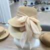 Hepburn style new simple and elegant bow streamer bucket hat women's summer sunscreen straw hat seaside vacation sunshade basin hat tide