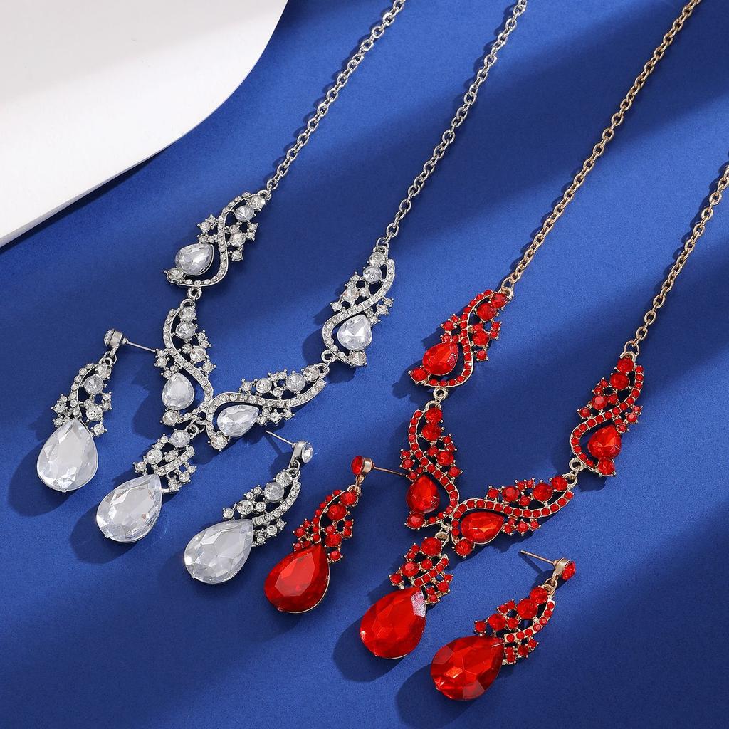 Overdreven banket smaragd ketting oorstekers set