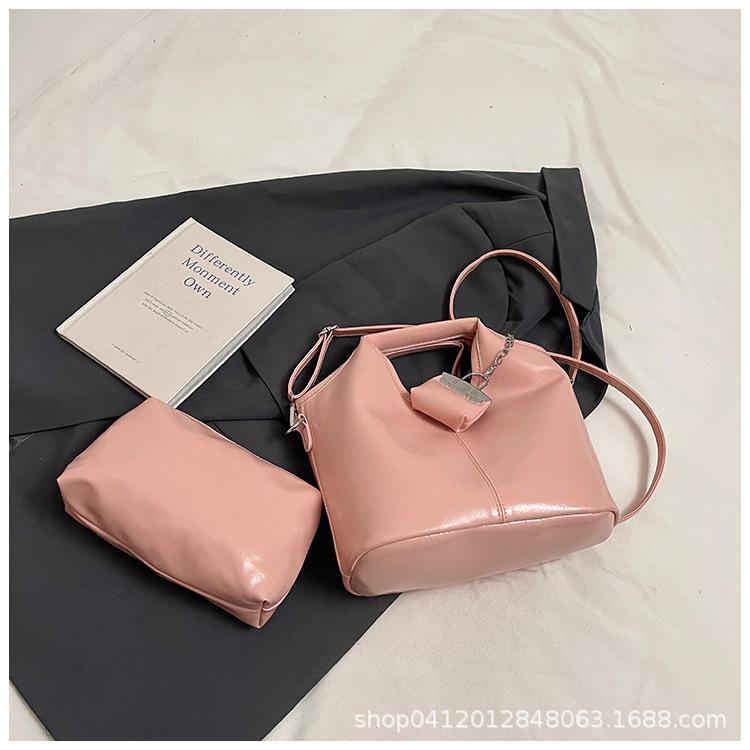 

Осень и зима ретро маленькая сумка женская 2025 новая мода универсальная сумка-мессенджер, высококлассная супер огненная портативная сумка-ведро розовый