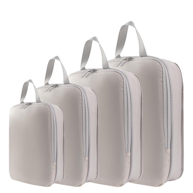 

Набор из четырех компрессионных дорожных мешков: Органайзер для одежды и туалетных принадлежностей