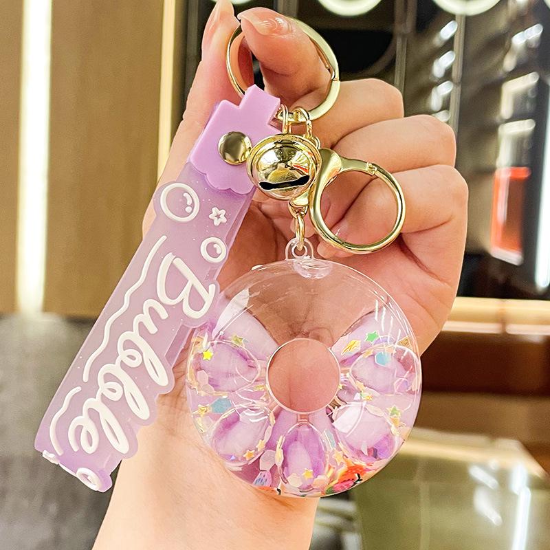 Luminous Oil-Filled Donut Quicksand Keychain: Exquisite Car Pendant & Bag Accessory, Ideal for Gifts.
