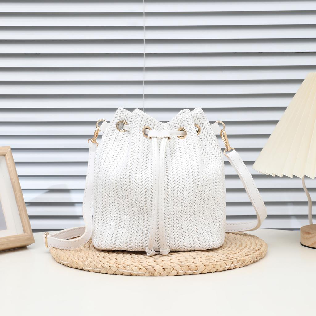 Bohemian Beige Straw Woven Bucket Crossbody Bag with Drawstring Closure Adjustable Leather Strap, Ideal for Beach Casual Daily