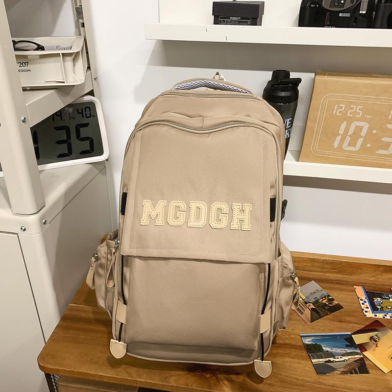 Schoolbag Japanese new solid color simple campus junior high school schoolbag Korean version girl backpack women's large capacity travel backpack