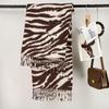 Autumn and winter new zebra pattern imitation cashmere scarf women's thickened warm shawl European and American versatile fringed scarf