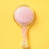 Hairbrush With Built-In Hair Tie