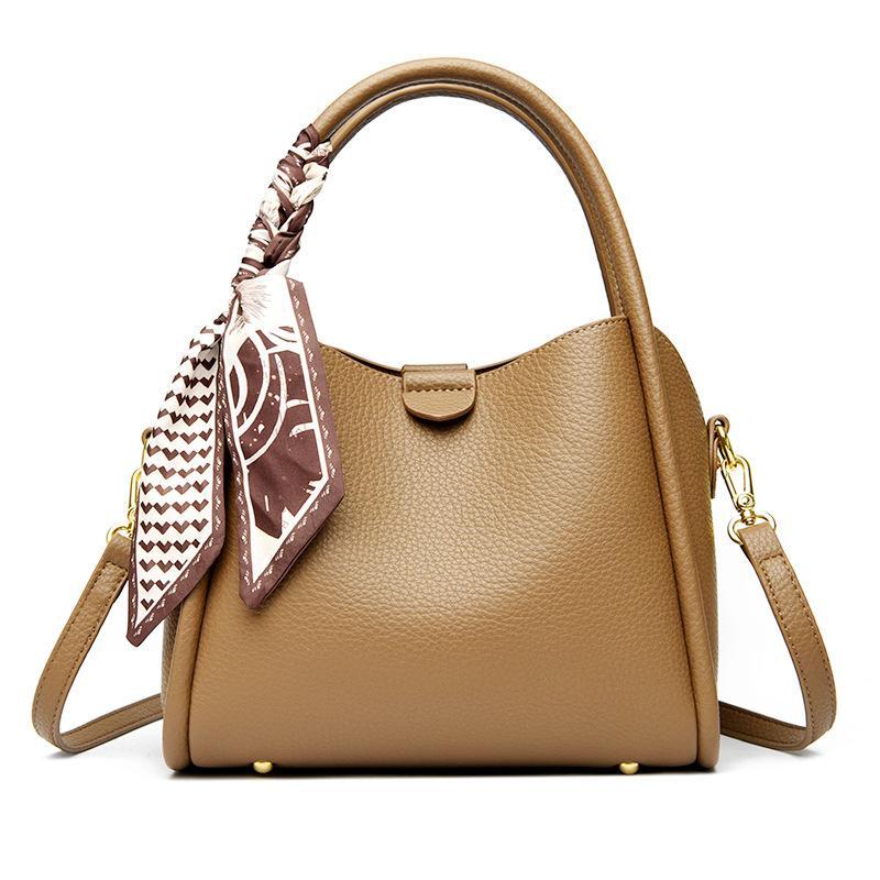 This Bucket Bag Is A Simple and Fashionable Urban Design with A Lychee Pattern and A Silk Scarf. It Is A Hand-held Shoulder Bag