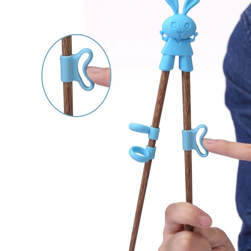Ess-Trainings-Essstäbchen Baby Lern-Geschirr Kinder Essstäbchen-Trainer Chinesische Essstäbchen Küchenzubehör Cartoon Kinder