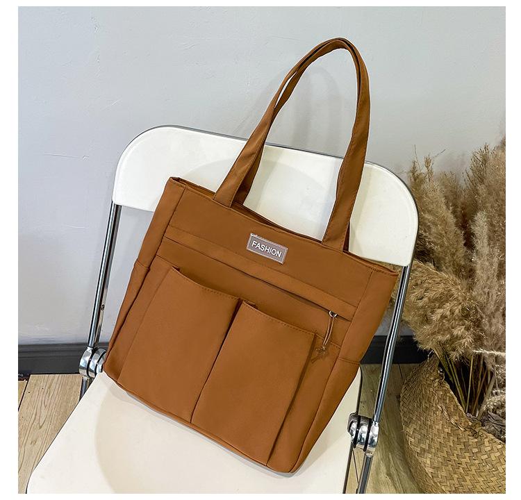 

New simple and versatile tote bag, Oxford cloth commuter handbag, women s bag, large-capacity women s shoulder bag. коричневий