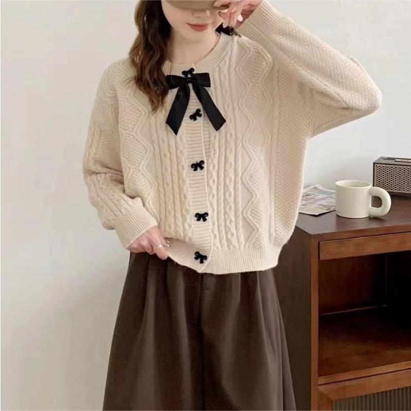 Solid color knitted cardigan women's new autumn and winter bow button with twist sweater jacket