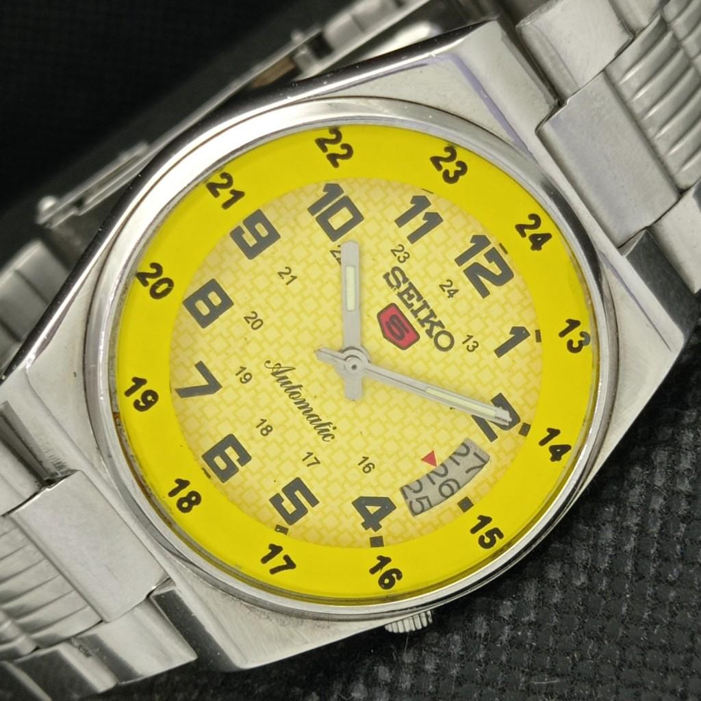 

USED VINTAGE SEIKO 5 AUTO 7009A JAPAN MENS DATE YELLOW WATCH 588a-a310120-2 SKU588a-a310120