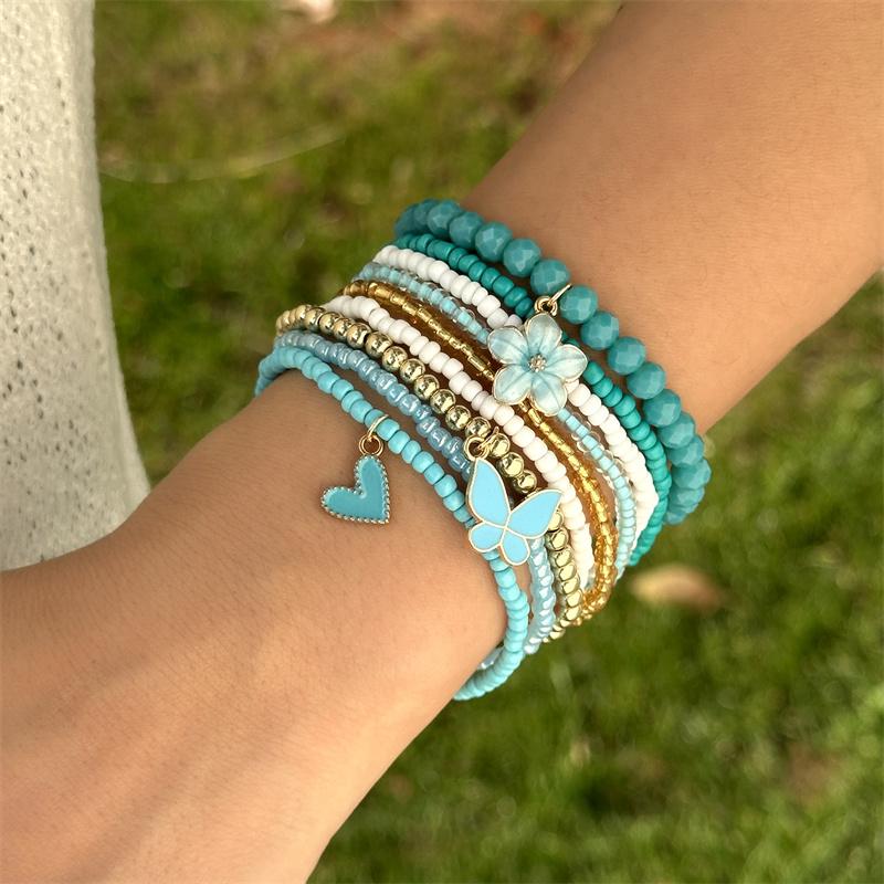 Set da 9 pezzi con Ciondoli a Forma di Farfalla, Fiore, Cuore con Perline, Braccialetti con Catena e Corda Elastica, Gioielli Regalo per Donna