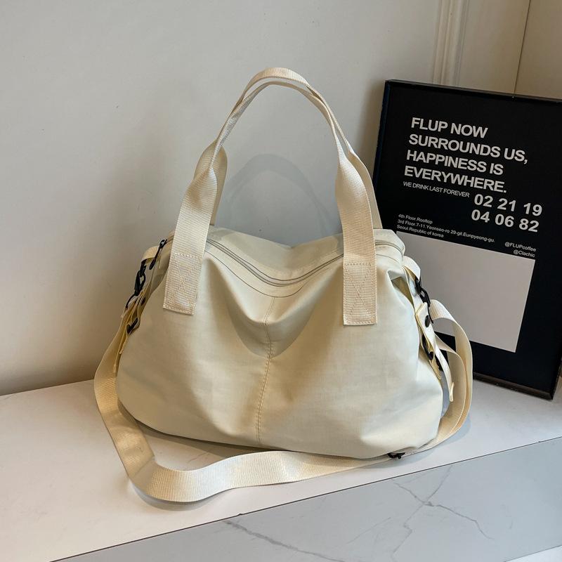 Handheld cloth bag women's bag with high texture and large capacity shoulder messenger bag, lazy and romantic to go to work, storage large bag