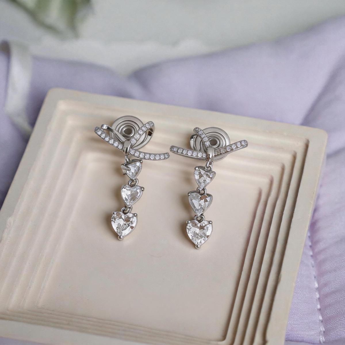 Zirconia Bow Heart Mosquito Coil Holder: Versatile, No-Piercing Ear Bone Clip Earrings for Women - Light Luxury Earring Accessories.