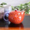 Stylish Kutani ware teapot with a vermilion arabesque pattern. Made in Japan. Includes tea strainer.
