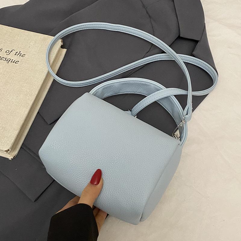 

This year, dopamine is popular, simple lychee pattern portable pillow bag, casual versatile commuter fashion messenger women s bag.