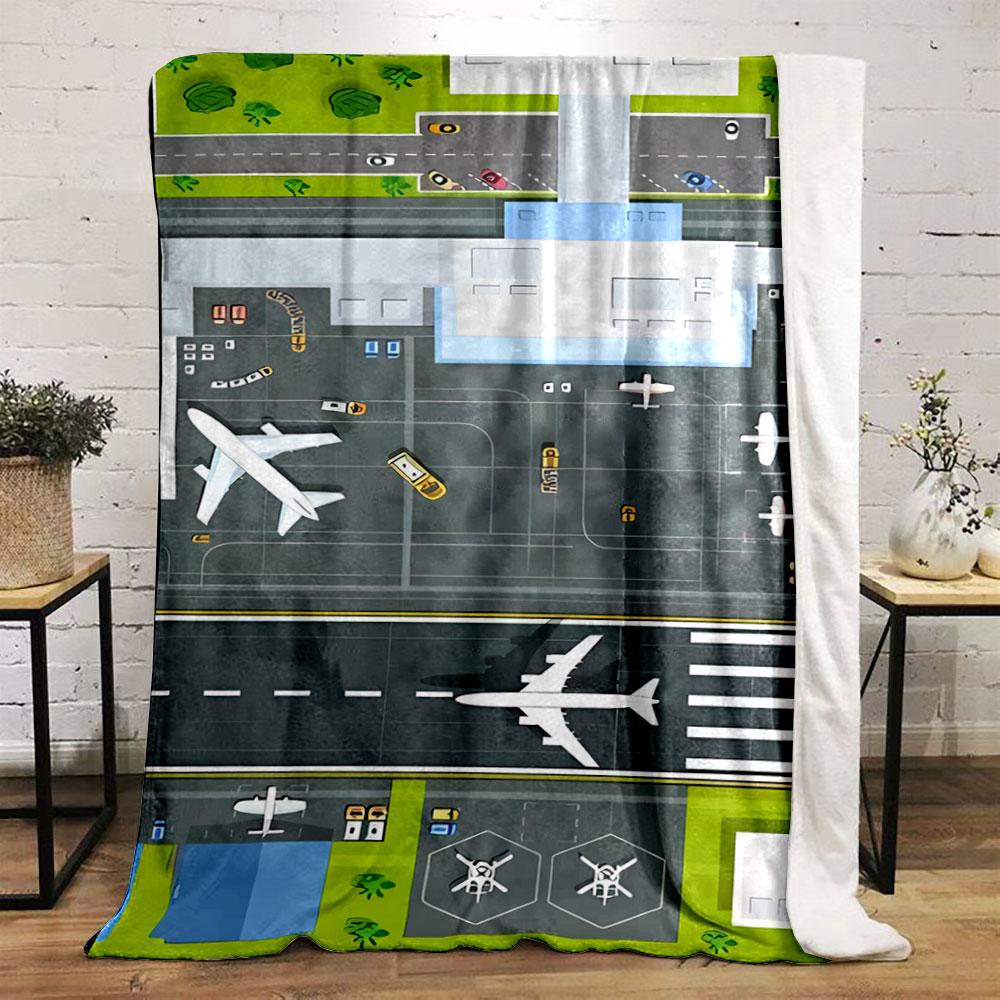 An aerial view of an airport layout with planes, runway, and vehicles. for all seasons blanket lunch break throw gift