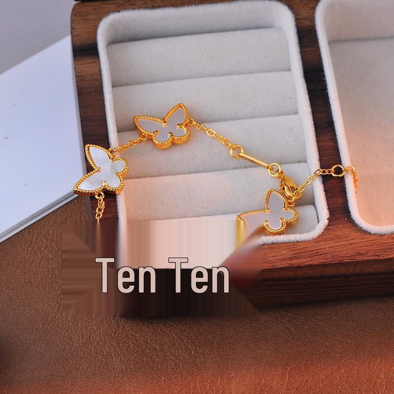 Elegantes kupfergoldenes doppelseitiges Schmetterlingsarmband mit einem vielseitigen Design