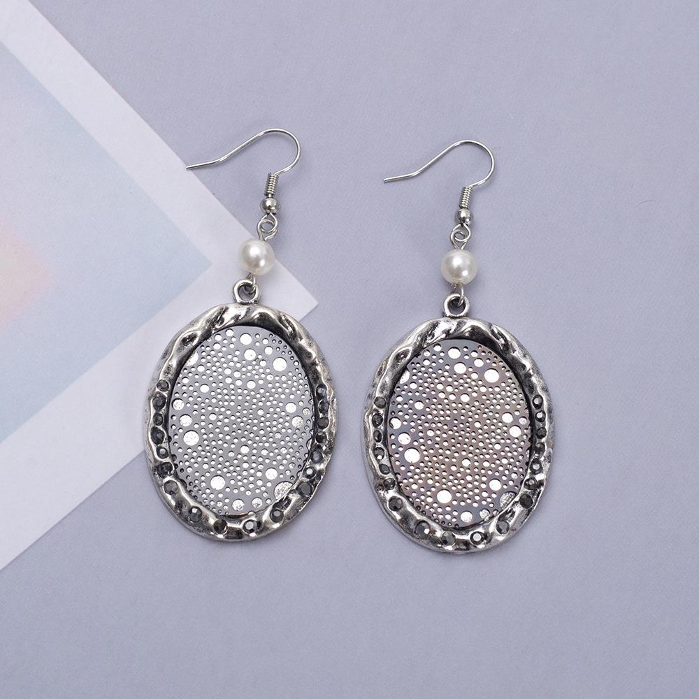 

Two-Tone Electroplated Irregular Concave-Convex Oval Alloy Earrings