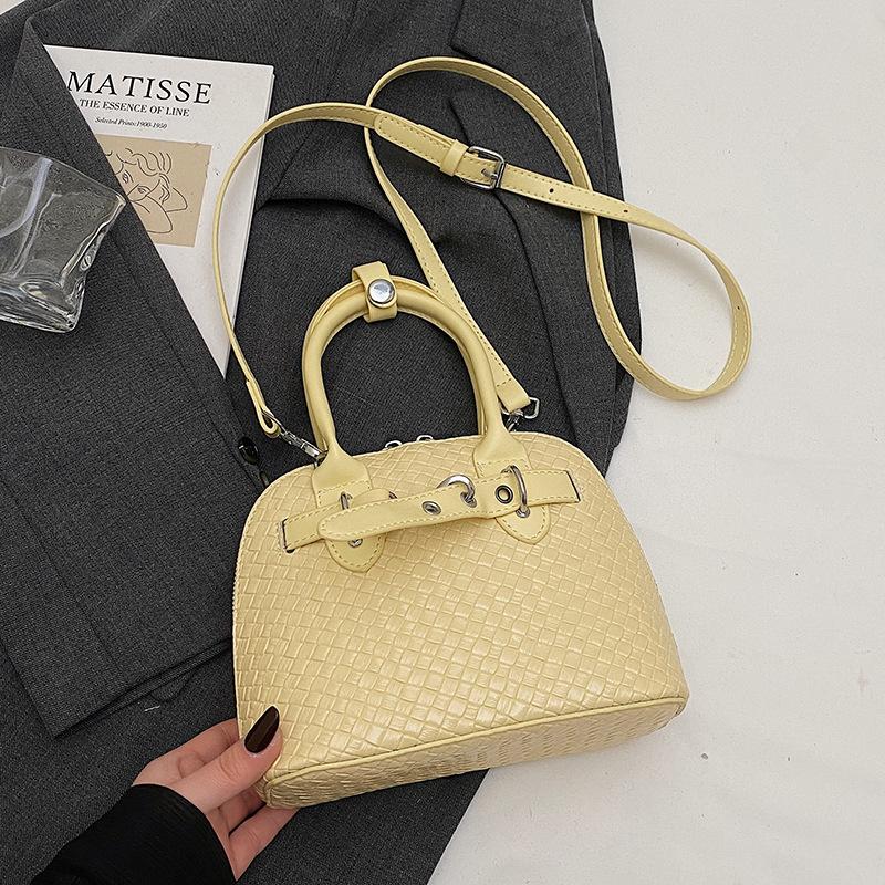 

This year s new Korean version of the fashion woven pattern portable shell bag, women s high-end sense Spice Girl style solid color PU messenger bag