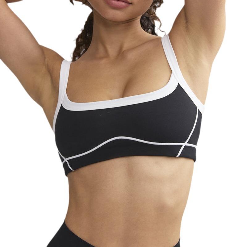 Yoga-Set in Kontrastfarbe: Hochelastischer Sport-BH und ausgestellte Hose mit Hüftlifting
