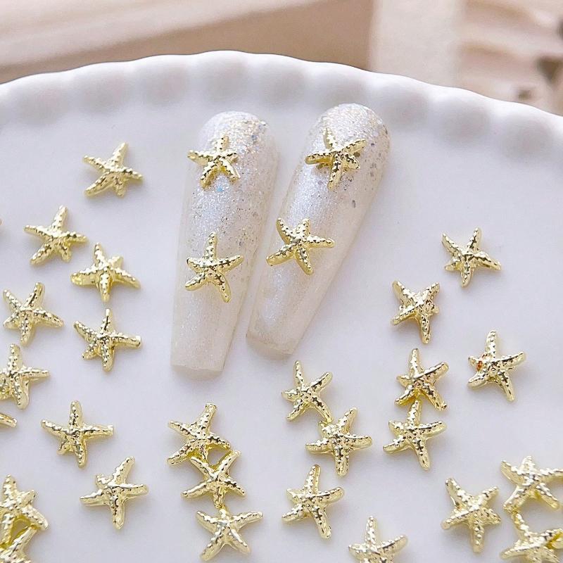 Goldene Seestern-Nagelanhänger Meeresstil Glitzernde Strasssteine Stern-Nagelkunst-Dekorationen Frühling Sommer 10 Stück 3D-Legierung DIY-Nagelsteine Geschenk für Mädchen