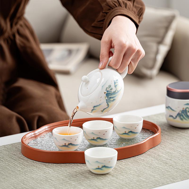 High-end creative leather bag set, suet jade gift, simple guest making teapot, Dehua ceramic express cup as a gift