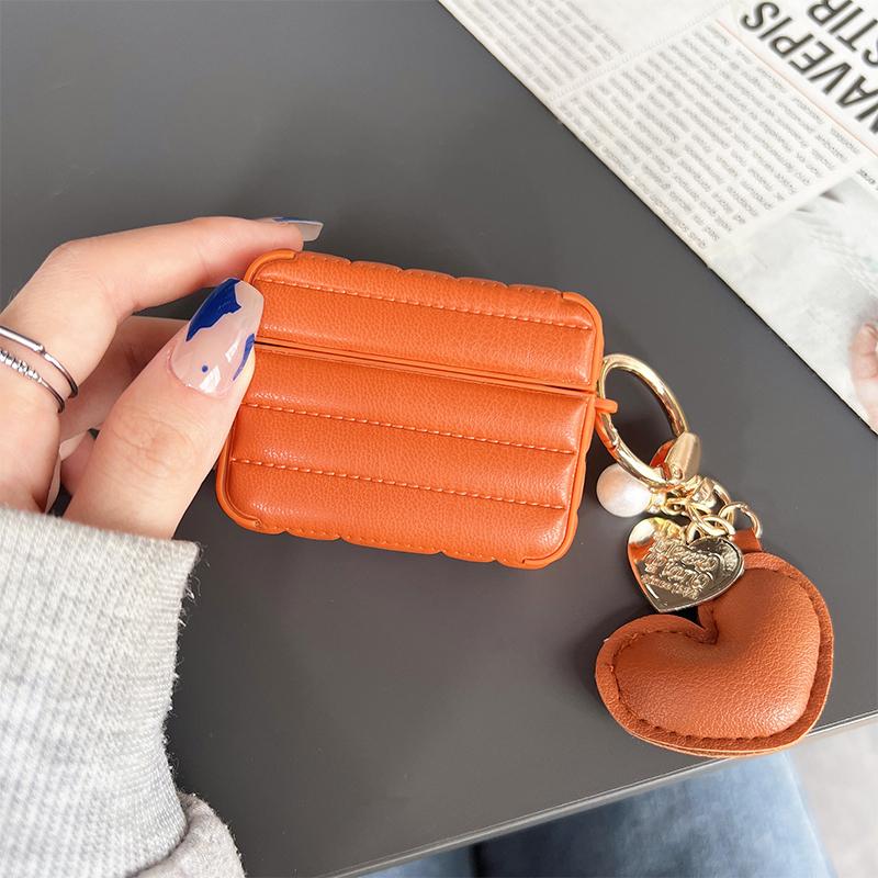 

For Apple AirPods 3 Stylish Down Jacket Pattern Earphone Case Leather+TPU Anti-fall Protective Cover with Heart Pendant Orange