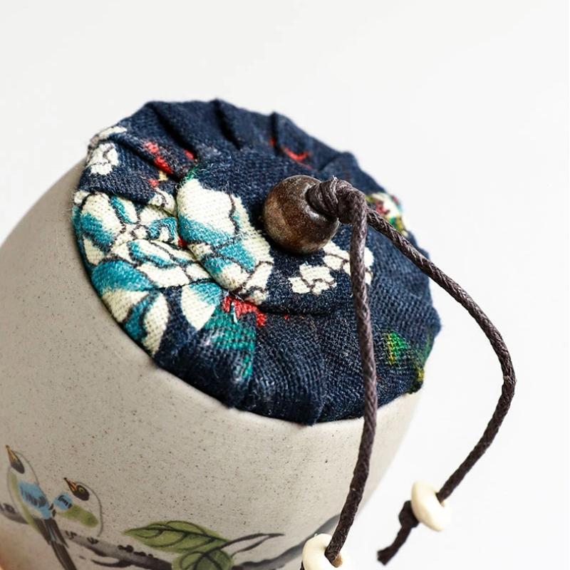 Portable Sealed Ceramic Tea Jar – Pottery Storage Canister with Plum, Orchid, Bamboo & Chrysanthemum Design