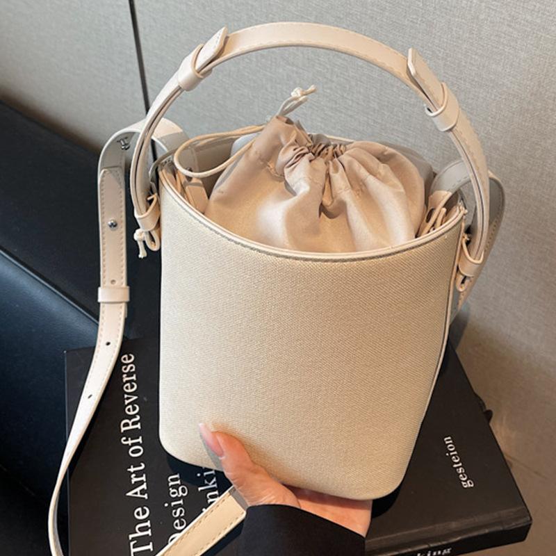 Niche design contrasting color portable bucket bag women's 2025 new casual retro handbag Korean version shoulder messenger bag