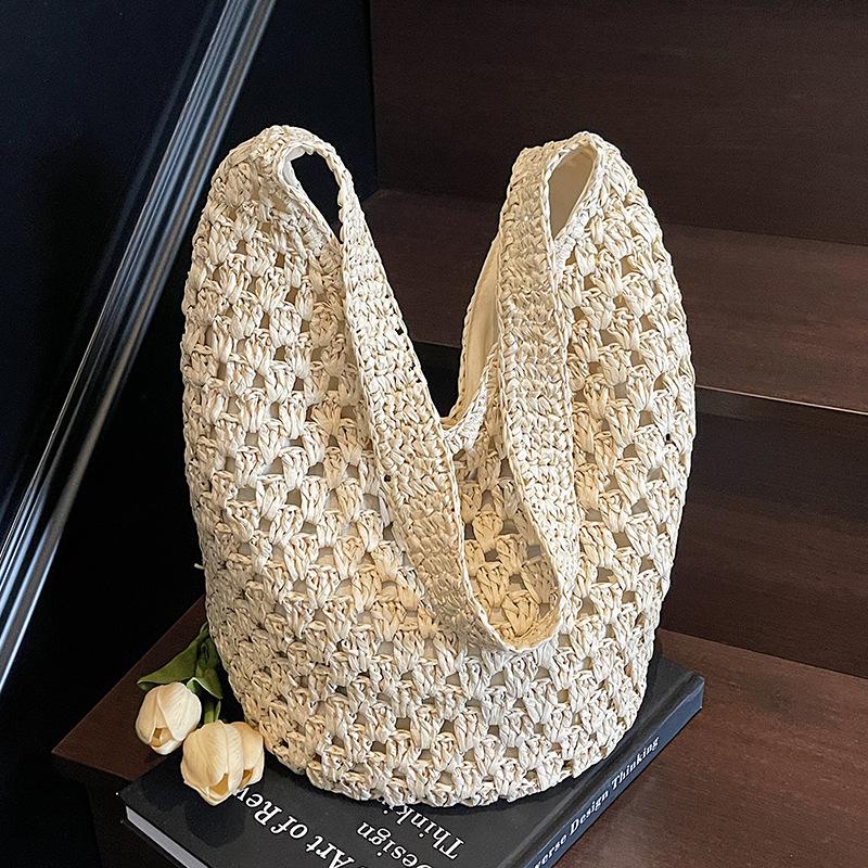 Neue hohle Stroh-Tragetasche Damen Strandurlaubsstil Lässige Schulter-Strandtasche Große Kapazität Stroh gewebte Tragetasche
