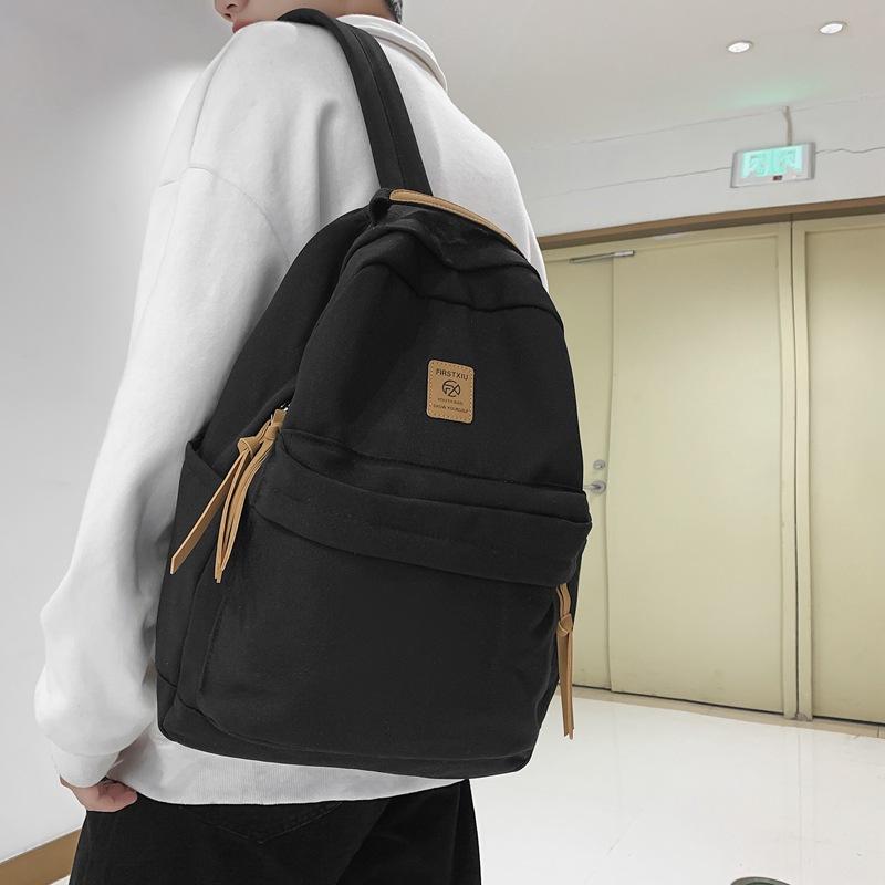Japanese solid color backpack female Korean version Harajuku simple high school student backpack campus junior high school student couple schoolbag