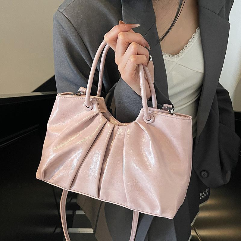 Korean version of foreign style niche design pleated handbag bag women's versatile foreign style advanced sense oil wax leather commuter messenger bag