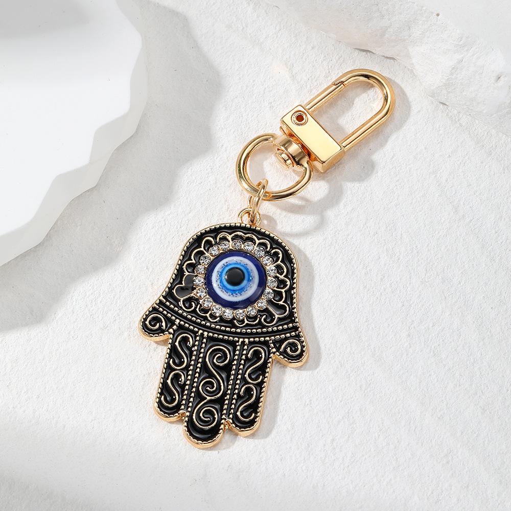 

Retro Ethnic Style Personality Totem Hand Keychain Zircon Hand Blue Eye Bag Car Airpods Case Key Accessories