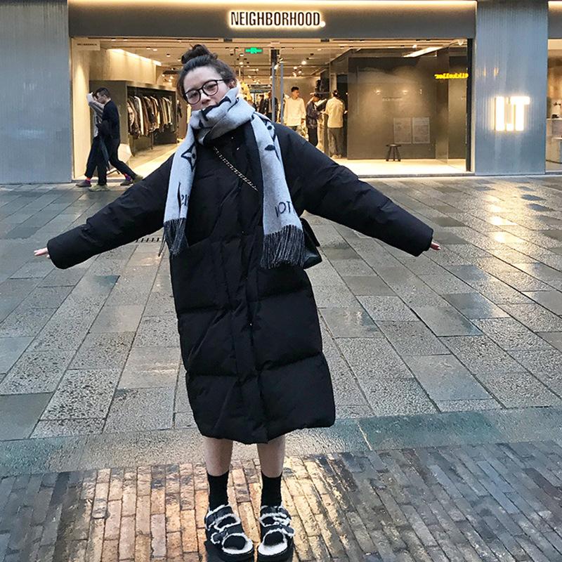 Stand-up collar medium and long down jacket women's 2024 winter new solid color large pocket thickened white duck down warm jacket tide