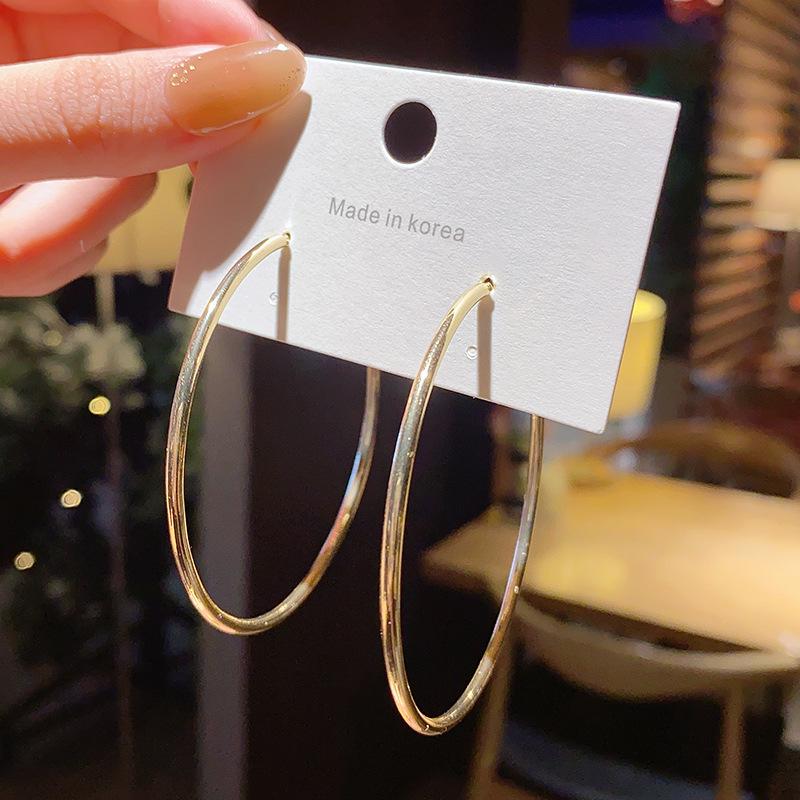 

Перебільшені срібні сережки-кільця S925 - Модна акцентна прикраса