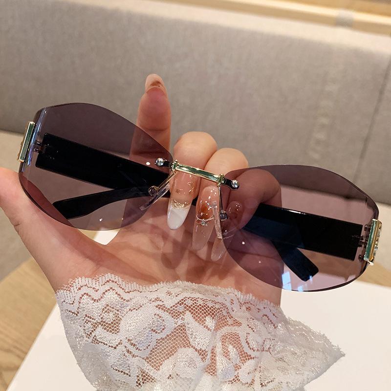 Women's Retro Frameless Oval Curved Lens Sunglasses Metal Sunglasses